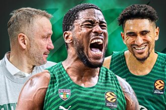 Three basketball players in green jerseys celebrate together; the central player shouts while the teammate on the right smiles, and a coach in a gray sweatshirt looks on from the left.