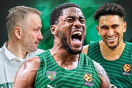 Three basketball players in green jerseys celebrate together; the central player shouts while the teammate on the right smiles, and a coach in a gray sweatshirt looks on from the left.