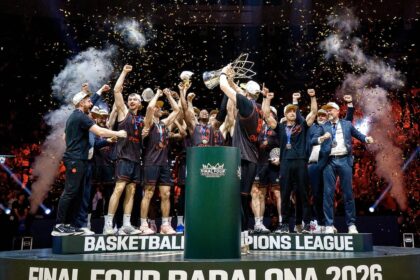 Basketball team celebrating on a podium with a trophy as confetti falls after winning Final Four Badalona 2026.