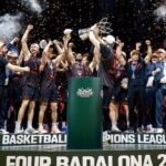 Basketball team celebrating on a podium with a trophy as confetti falls after winning Final Four Badalona 2026.