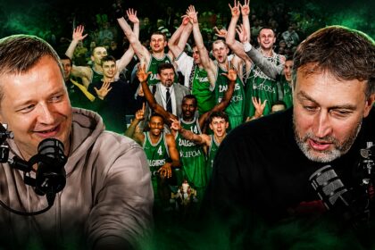 Two broadcasters with professional microphones in the foreground, a cheering basketball team behind them in green uniforms.