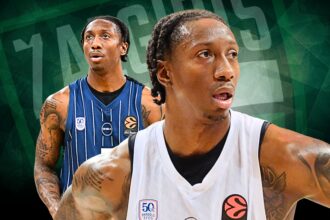 Two basketball players on a green geometric background; foreground player in a white jersey with tattoos, looking to the right, with a blue-striped player behind him.