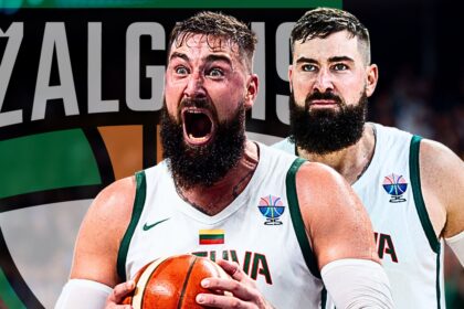 Two bearded basketball players celebrate on the court, one shouting with ball in hand, wearing white uniforms with green trim.