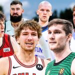 Six male basketball players pose together outdoors in colorful uniforms, one holding a basketball at the front.