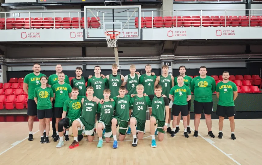 Lithuanian basketball team posing for a group photo on an indoor court, wearing green jerseys with 'LIETUVA'.