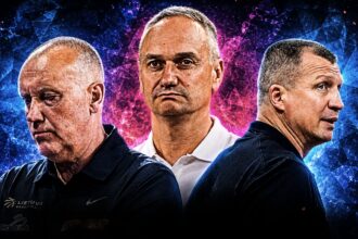 Three men in dark jerseys stand back-to-back with serious expressions against a blue-pink abstract background; central figure prominent.
